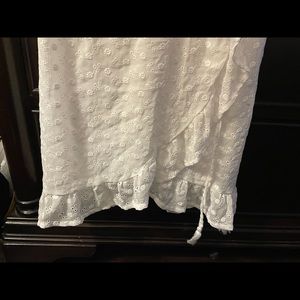 Cute summer dress with a tie and fringe on the ends.